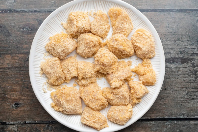 Overhead view of keto chicken nuggets on a plate just prior to being fried.