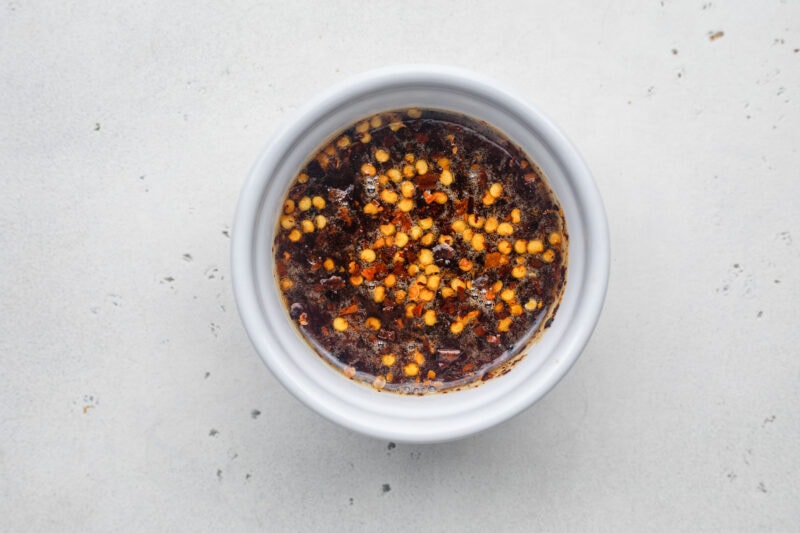 Hot honey sauce in a small ramekin.