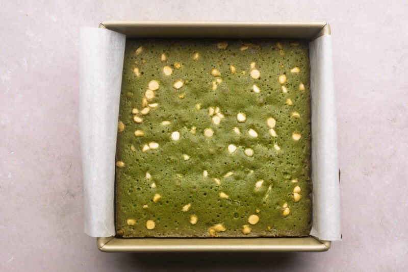 Fully baked matcha brownies in a square baking dish.