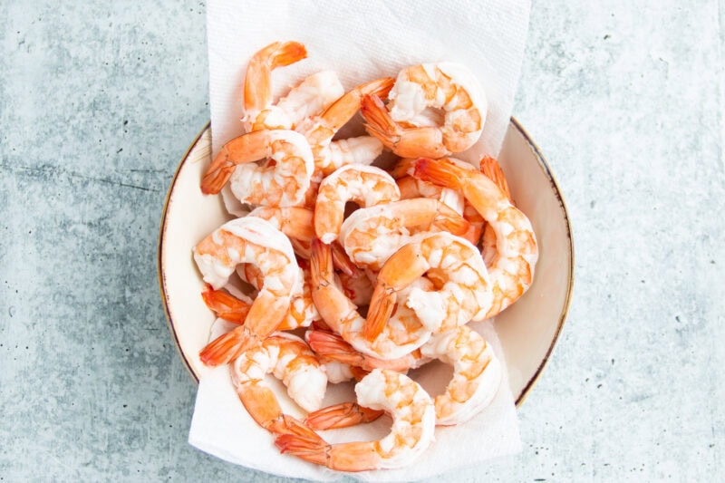 Poached shrimp in bowl.