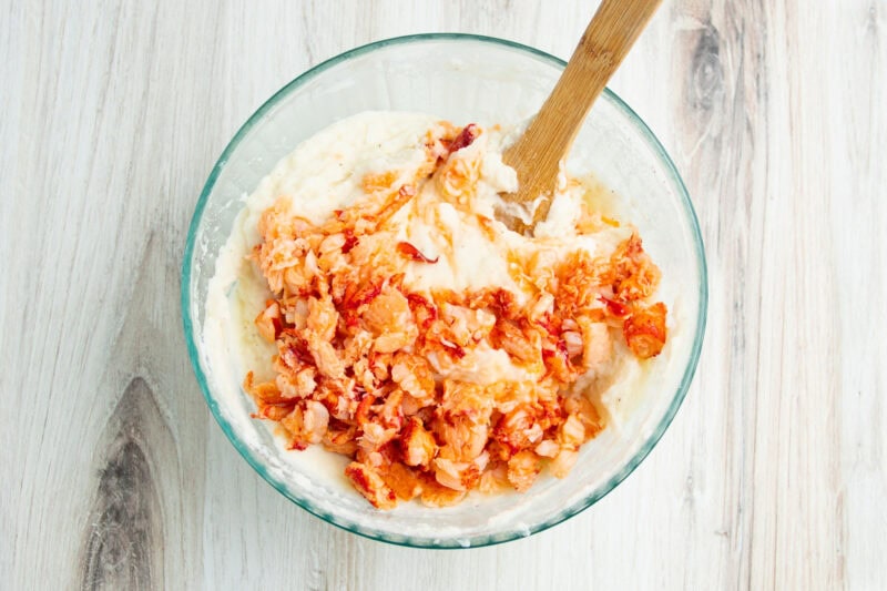 Lobster and mashed potatoes in large glass mixing bowl.
