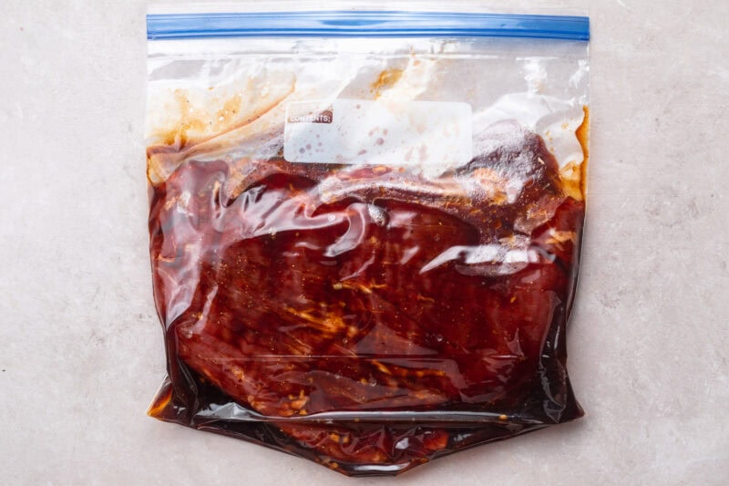 Flank steak and marinade in large ziploc bag.