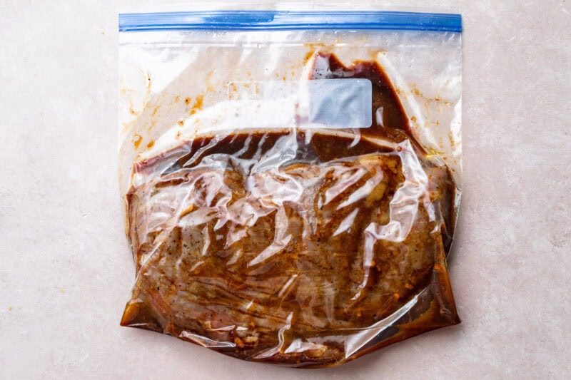 Cooked sous vide flank steak in large ziploc bag with remaining marinade.