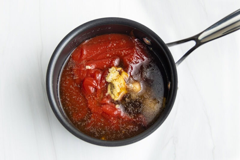 Homemade BBQ sauce ingredients in a small saucepan.