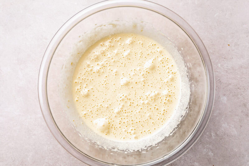 Sugar and eggs beaten together in large glass mixing bowl.