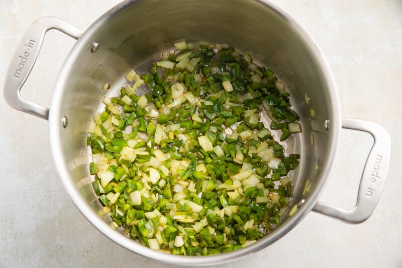 Jalapeño peppers and onions in a large saucepan.