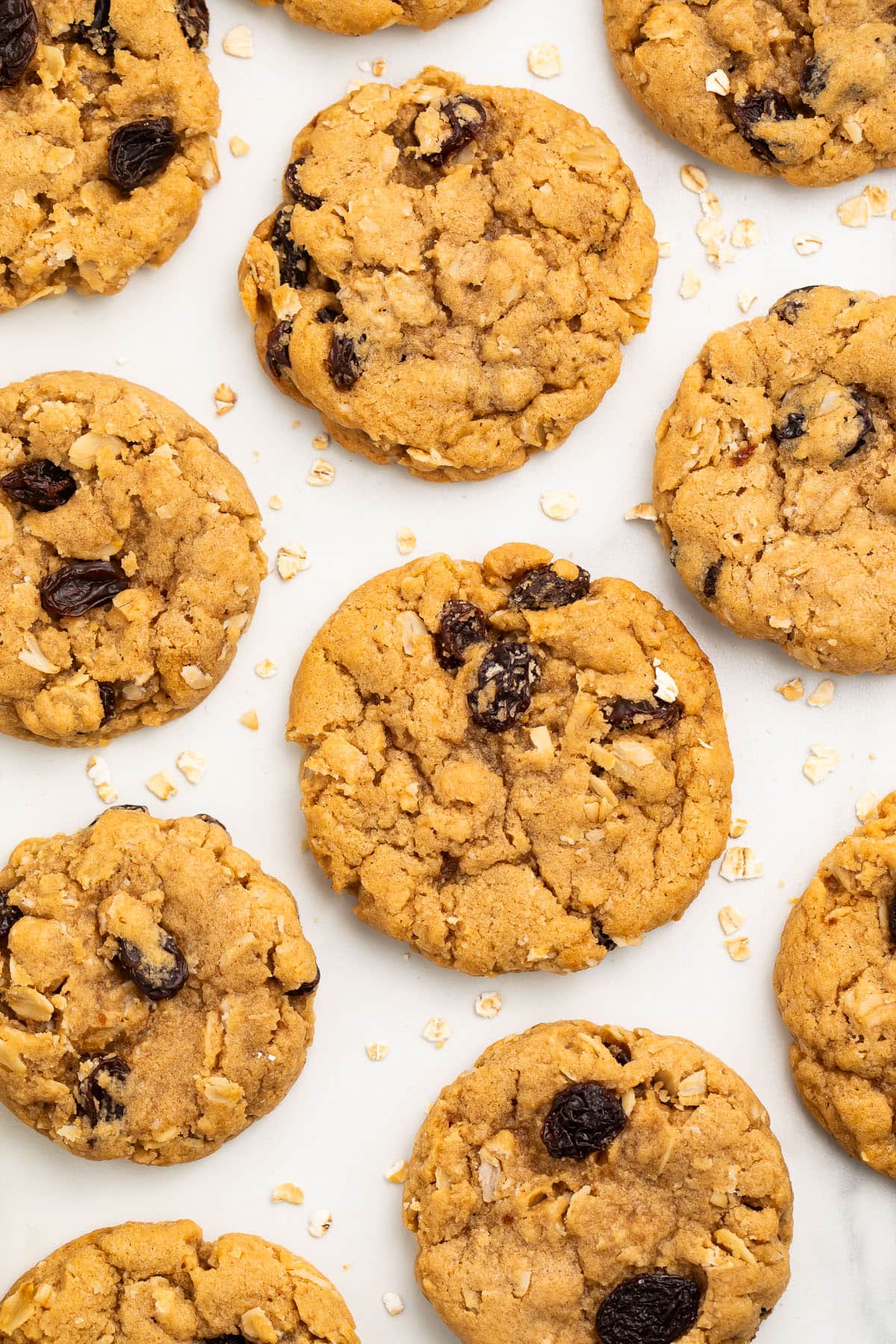 Vegan oatmeal cookies on a sheet of parchment paper.