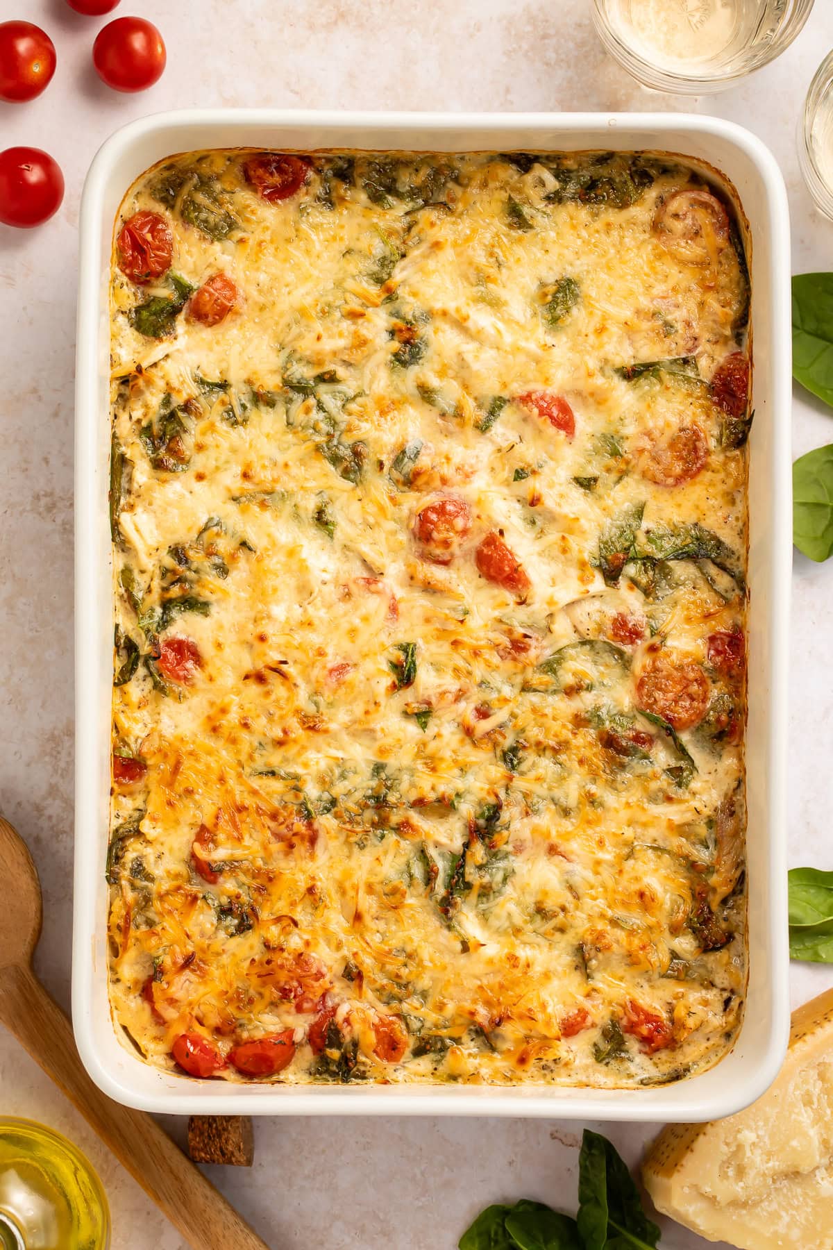 Overhead picture of a chicken and orzo pasta bake with a melted cheese top.