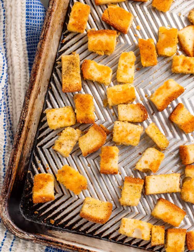 Close up of croutons on a baking sheet.