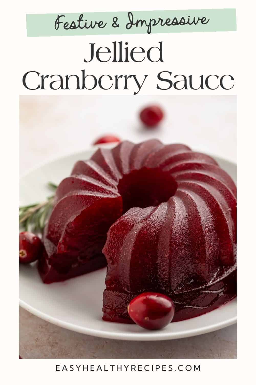 Jellied cranberry sauce set into a wreath shape with a slice missing on a white plate. Text is overlayed in the style of a Pinterest pin.