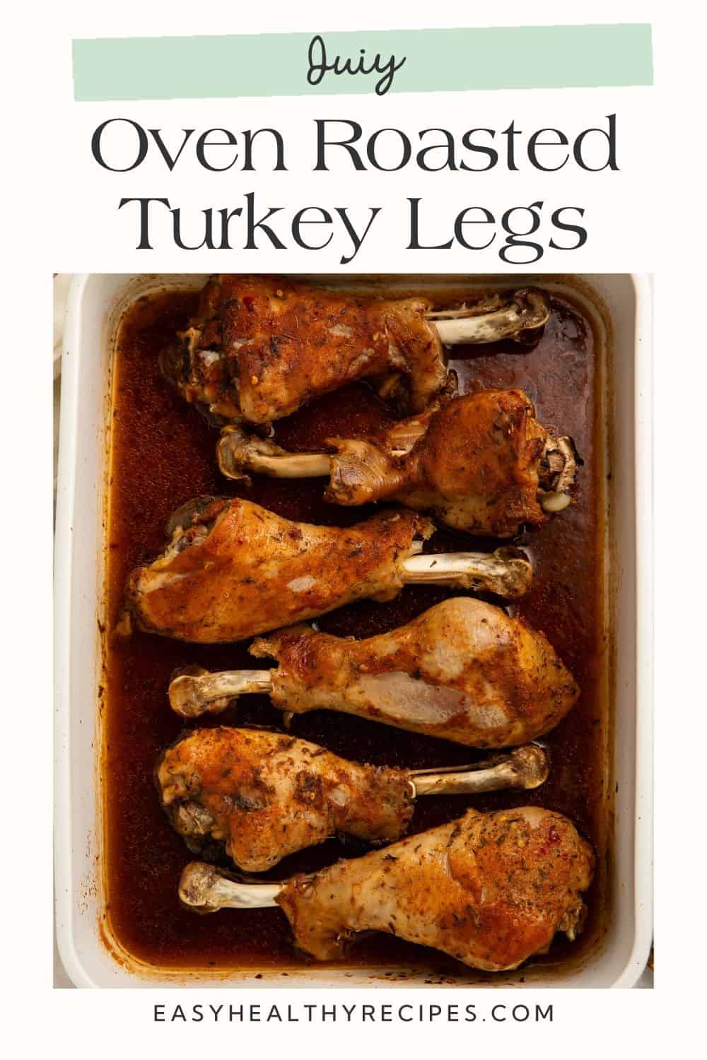 Roasted turkey legs arranged in a white baking dish with Pinterest text overlaid.