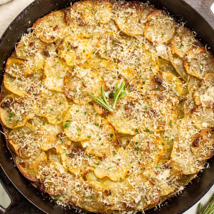 Overhead image of a potato galette in a cast iron skillet.