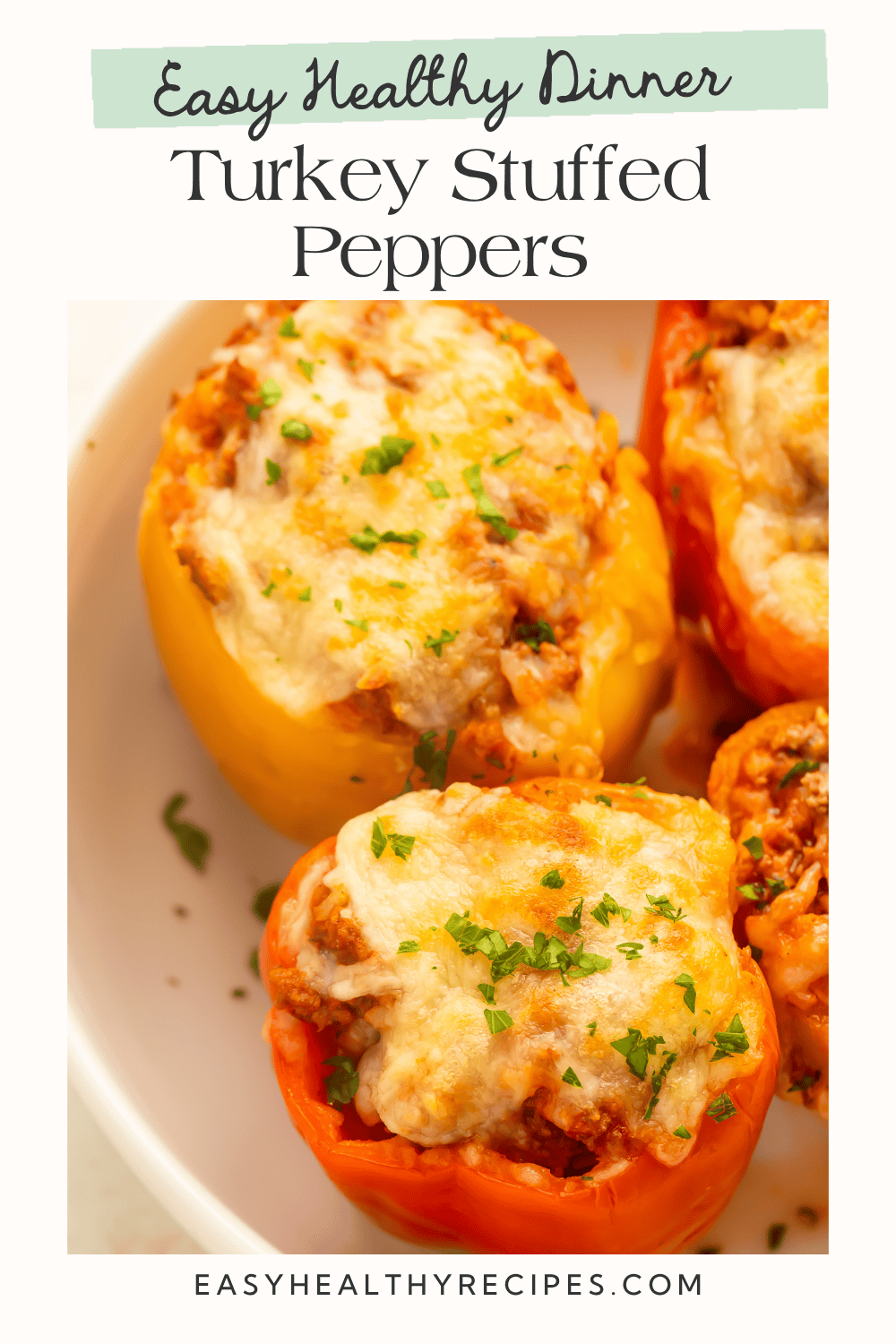 Pinterest graphic featuring cheesy baked turkey stuffed peppers made with colorful bell peppers, seasoned ground turkey, rice, and melted cheese.