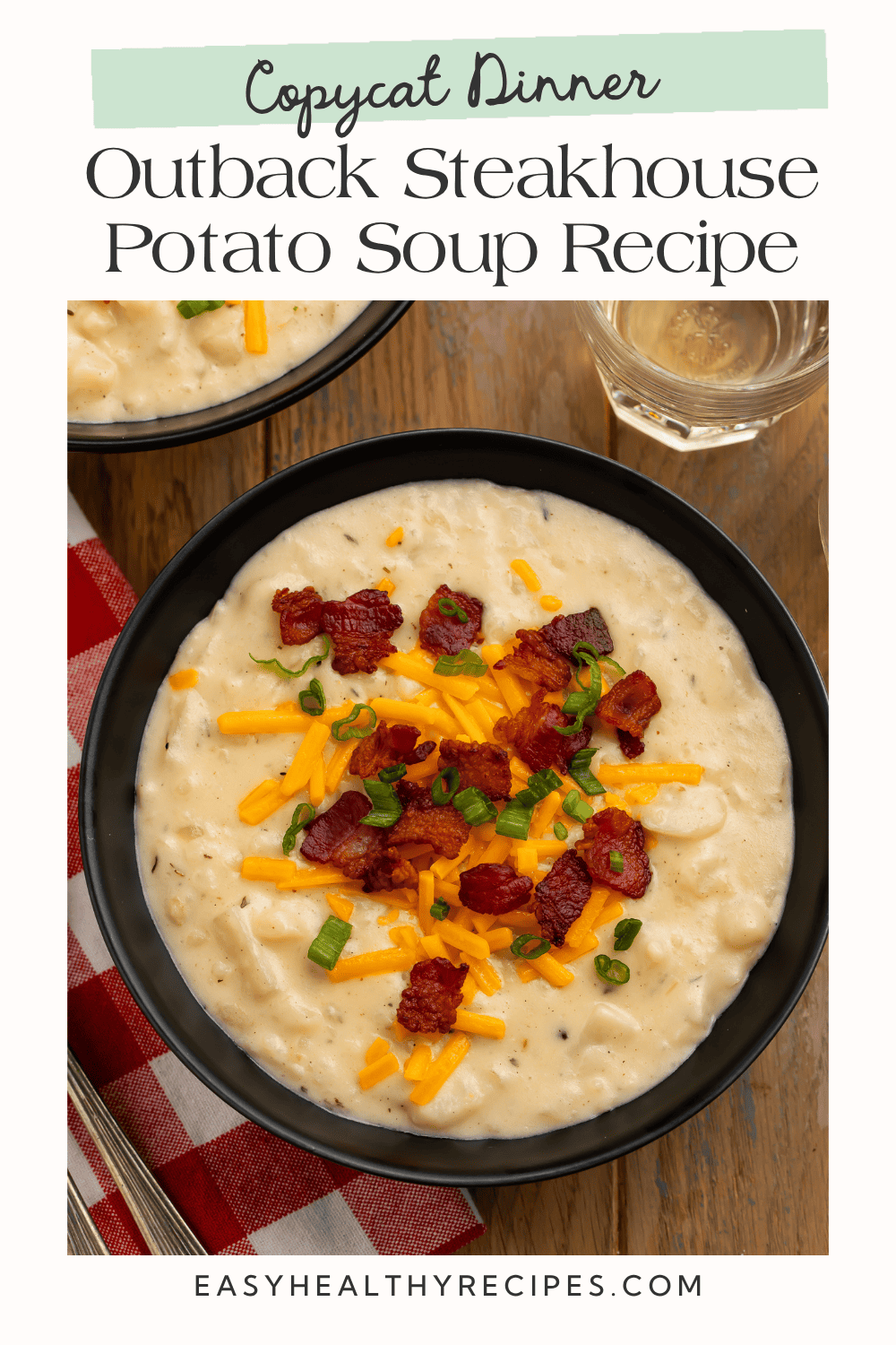Copycat Outback Steakhouse potato soup topped with crispy bacon, shredded cheese, and green onions.
