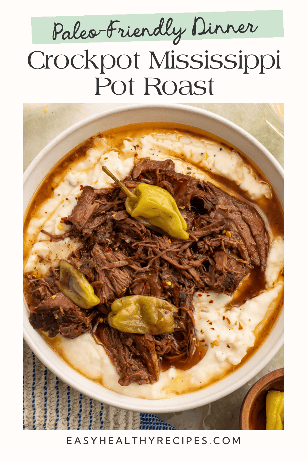 Paleo-friendly dinner graphic with Crockpot Mississippi Pot Roast, pepperoncini, and cooking juices over mashed potatoes.