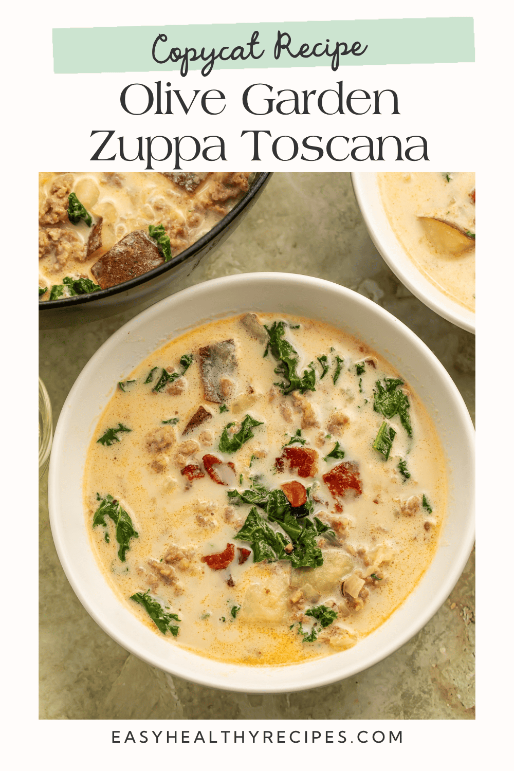 Image 1 — recipe(01).png Olive Garden copycat zuppa toscana in a white bowl with Italian sausage, russet potatoes, kale, and bacon in creamy broth.