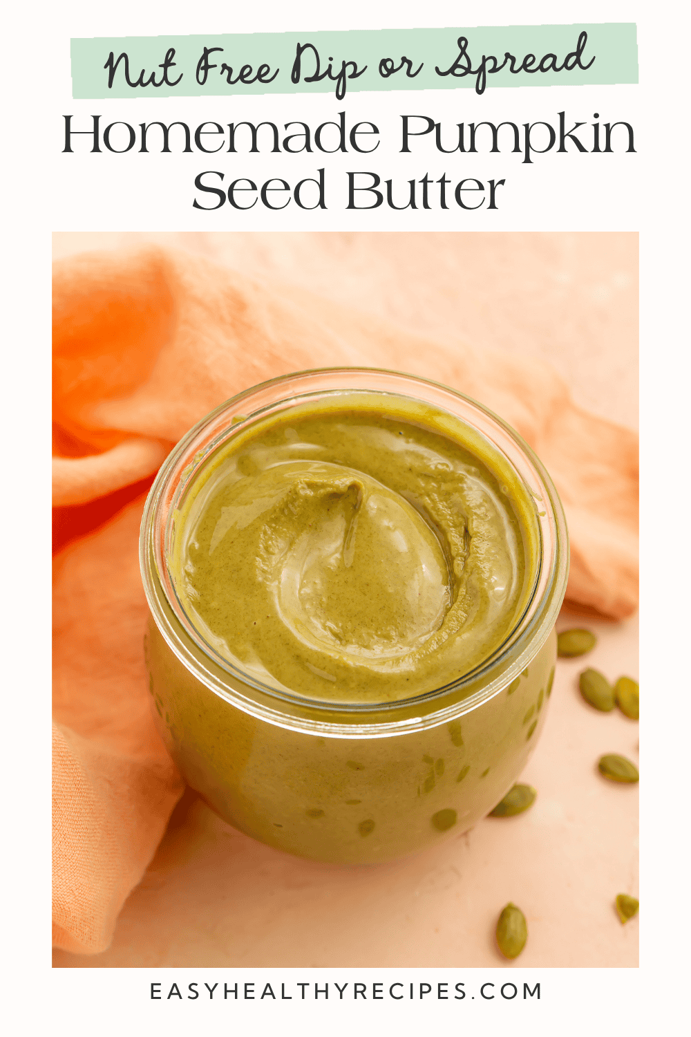 Homemade pumpkin seed butter, a nut-free dip or spread, shown in a glass jar with pumpkin seeds.