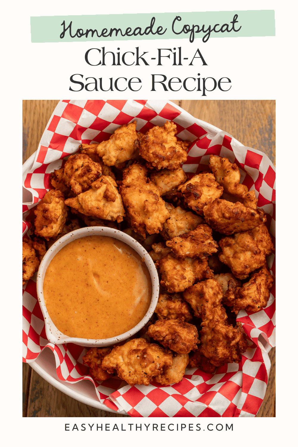 Bowl of creamy orange sauce surrounded by golden chicken nuggets, beneath the heading “Homemade Copycat Chick-Fil-A Sauce Recipe.”