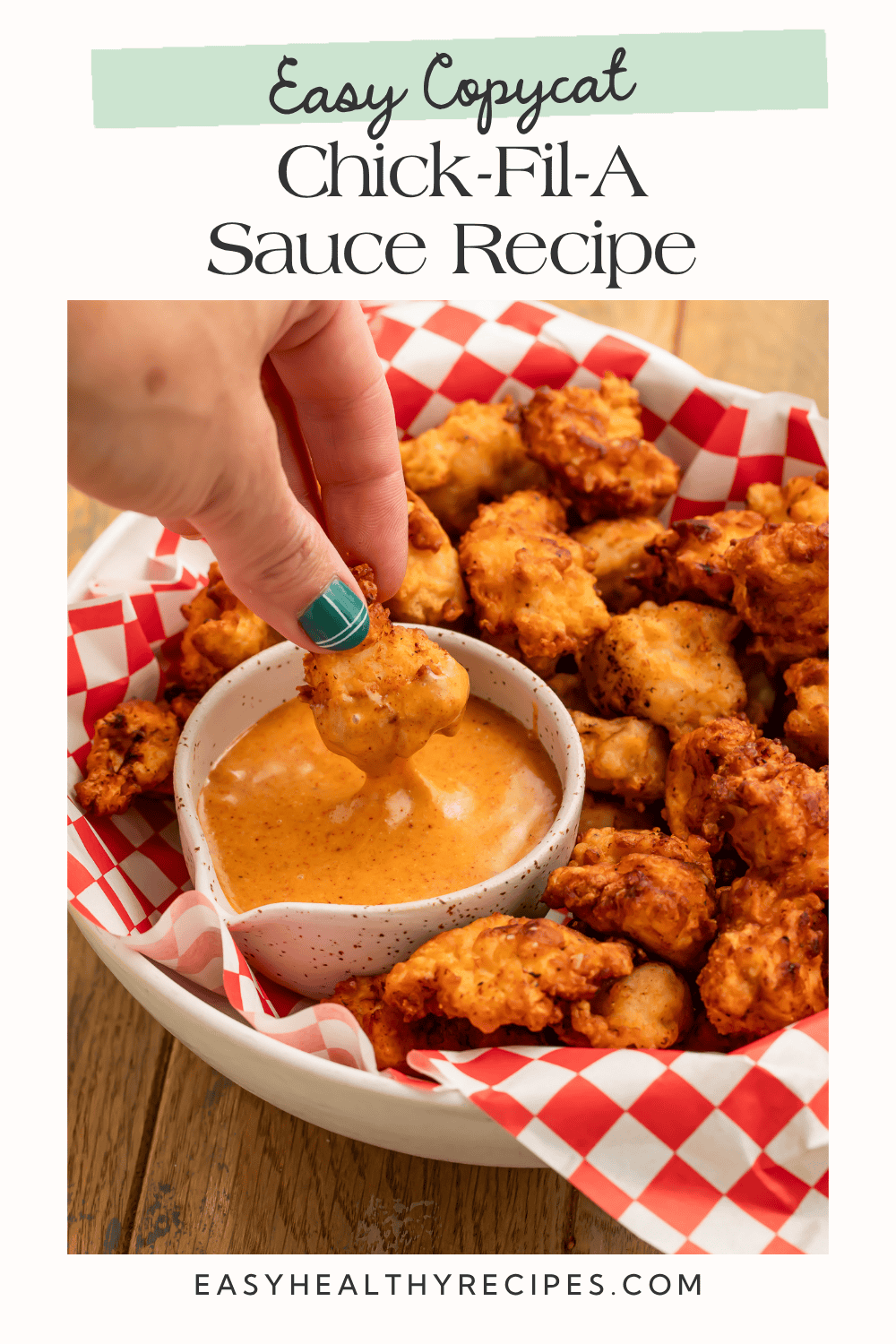 Hand dipping a crispy chicken nugget into creamy sauce, beneath the heading “Easy Copycat Chick-Fil-A Sauce Recipe.”