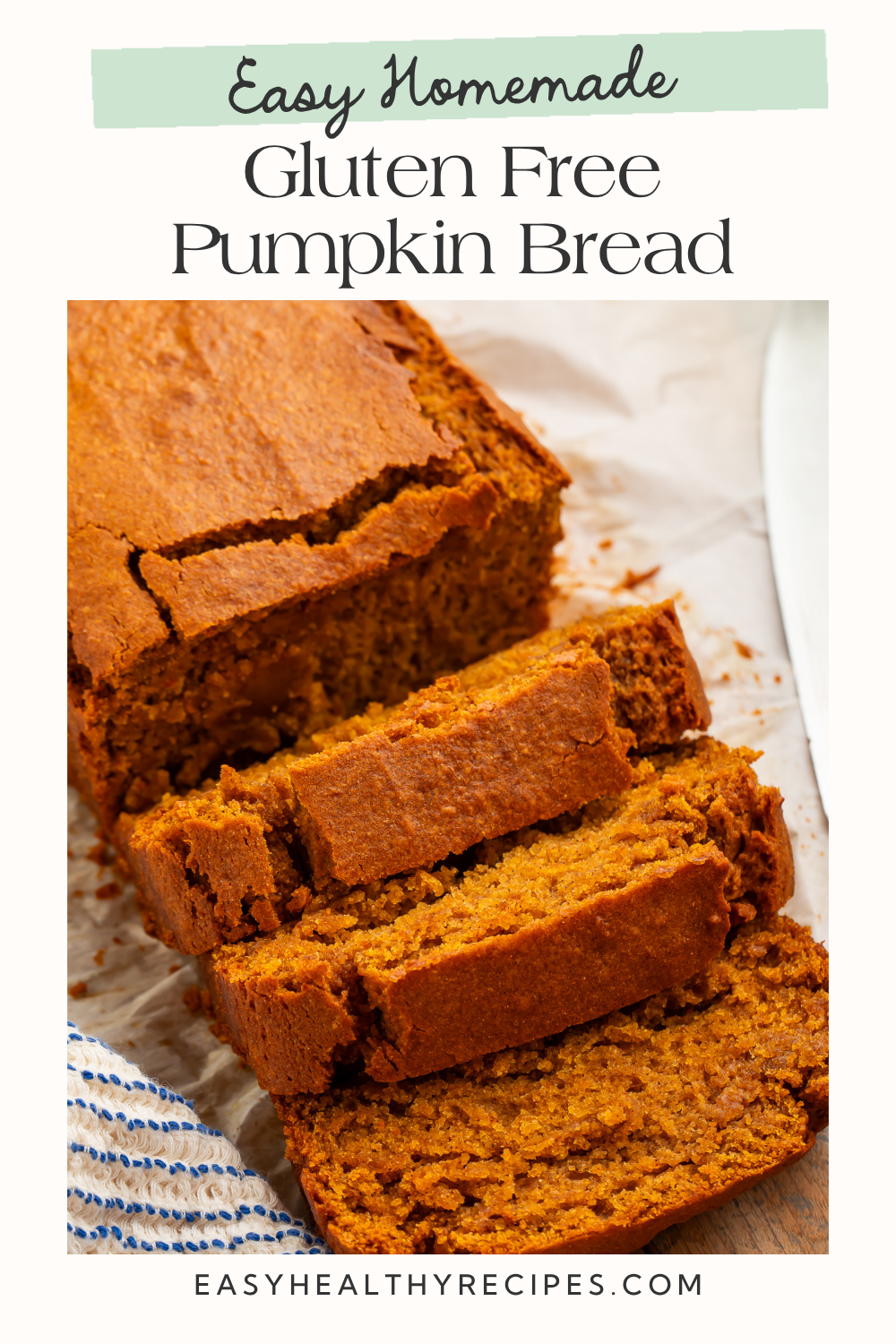 A partially sliced pumpkin loaf on parchment beneath the text “Easy Homemade Gluten Free Pumpkin Bread.”