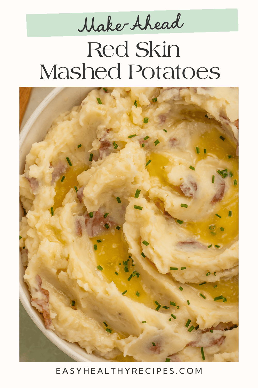 Red skin mashed potatoes topped with melted butter and chives, with text reading “Make-Ahead Red Skin Mashed Potatoes.”