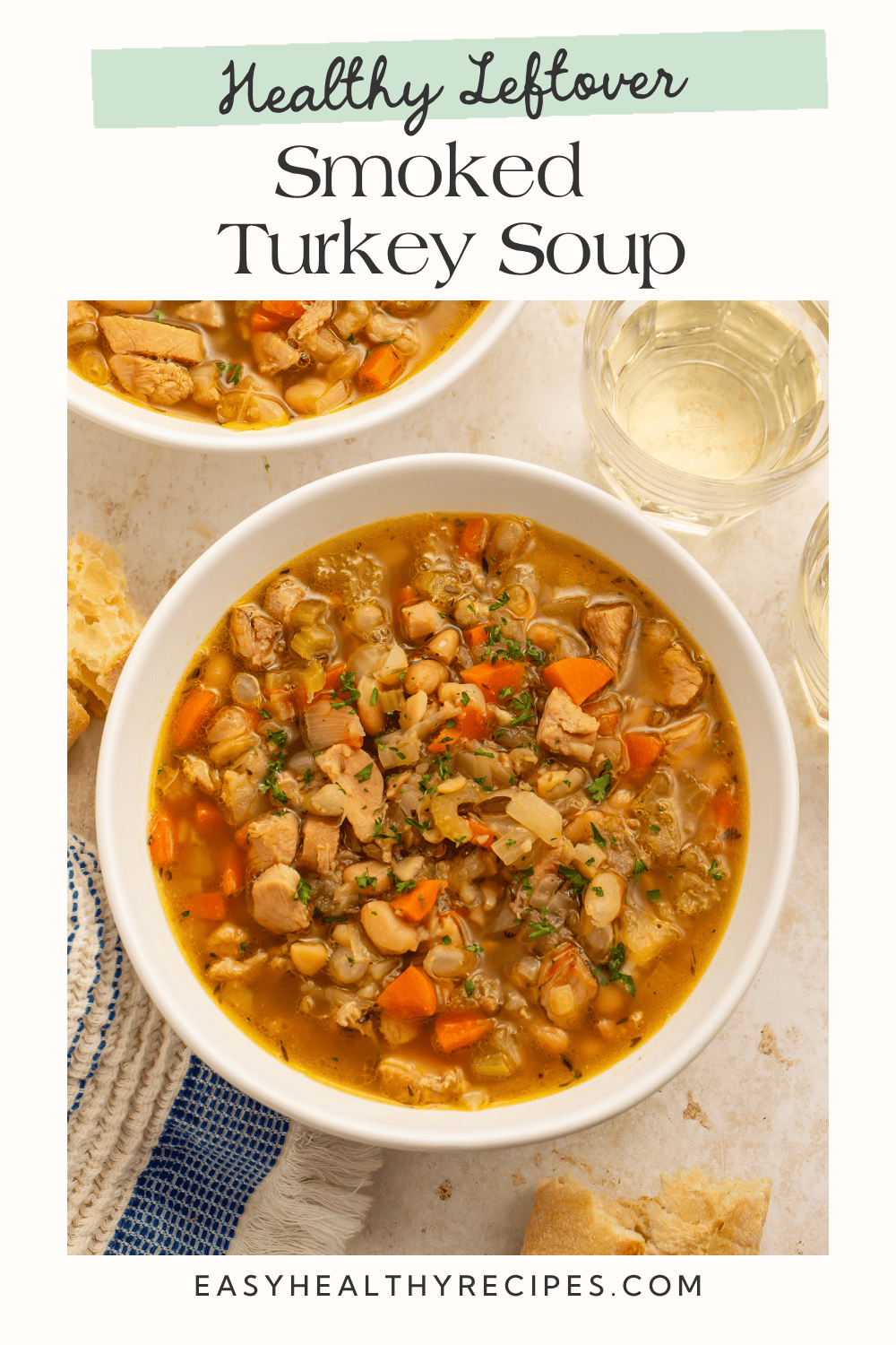Bowl of smoked turkey soup with white beans, carrots, and celery. Pinterest graphic reads “Healthy Leftover Smoked Turkey Soup.”